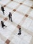 Blurred Business People Walking On Tiled Floor