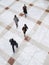 Blurred Business People Walking On Tiled Floor