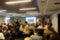 Blurred business seminar meeting in the conference hall. Defocused people