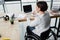 blurred businesswoman in wheelchair writing in