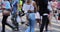 Blurred Busy crowds of men and women or Commuters Crossing Street in Central, Hong Kong, with Crosswalk yellow lines. zebra yellow