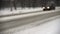 Blurred cars lights on a winter snowy street