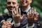 blurred and cheerful gay newlyweds in