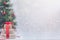 Blurred Christmas tree and gift boxes. Light festive background. Holidays, celebration and presents concept