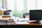 Blurred of Cluttered desk, full of documents A mess desk with many working stuff