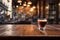 Blurred coffee shop scene as a background to a brown tabletop