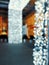 Blurred cold white lights looked festive and beautiful bokeh background. Entrance in building with Bright lights in arched