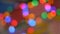 Blurred colorful lights. Red, green, yellow, orange, blue defocused glittering bokeh festive background.