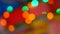 Blurred colorful lights. Red, green, yellow, orange, blue defocused glittering bokeh festive background.