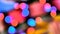 Blurred colorful lights. Red, green, yellow, orange, blue defocused glittering bokeh festive background.