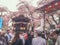 Blurred crowd people at japanese full bloom cherry blossom or sakura hanami festival background