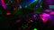 Blurred dancing crowd of people in a nightclub at party with a DJ music mixer