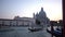 Blurred defocused of Basilica Santa Maria della Salute and traditional gondola