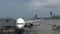 Blurred defocused ground crew busy getting a plane ready to fly at airport