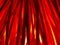 Blurred defocused Halloween horizontal background. Bundle sticks backlighted by red lamp.