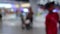 Blurred or defocused shopping mall interior with people walking at holiday