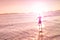 Blurred defocused silhouette of man standing at beach