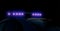Blurred defocused silhouette of road police patrol car with lightbar alarm emergency on the street of city at night. Flashing blue