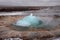 Blurred. The eruption of the Strokkur geyser in the southwestern part of Iceland in a geothermal area near the river Hvitau