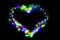 Blurred festive background with defocused colourful glitter formed a heart, bokeh in a shape of a heart. Original photographic