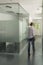 Blurred figure of a woman walking in the hallway of a modern office building