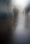 Blurred figures of people walking in strong fog