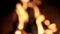 Blurred fire flame at black background. Out of focus