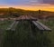 Blurred Focused Beautiful twilight picturesque farmland view of Middle Valley, Canterbury, New Zealand. Wooden bench and table in