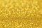 Blurred glitter background gold color.