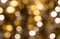 Blurred golden christmas lights bokeh