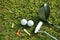 Blurred golf club and golf ball close up in grass field