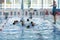 Blurred. Group of Children learn to swim in the pool