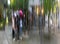 Blurred group of young people under umbrellas