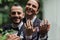 blurred and happy gay newlyweds in