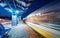 Blurred high speed train on the railway station at night