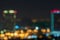 Blurred highway and skyline at night for corporate business concepts and urban city planning. Skyscrapers at twilight.