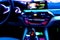 Blurred image of car interior. Dashboard. Blur defocused transportation background. Driving inside car. Bokeh light background. Bl