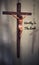 Blurred image of Christ the Lord on the Cross with text - Worthy Is The Lamb.