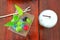 Blurred image, cool coffee mug  Green tree  On a beautiful wooden table