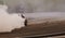 Blurred of image diffusion race drift car with lots of smoke from burning rubber on speed track