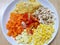 Blurred image of ingredient with omelet,tomato,grilled chicken breast,carrot,baby corn and corn decorative