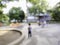 Blurred image of lone child in playground park alone boy standing on childrens playing urban city space out of focus shot of