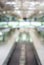 Blurred image of moving modern escalator way in the airport hall