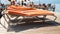 Blurred image of people relaxing on sunbeds on the wooden pier at sea. Summer holidays on beach