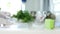 Blurred image of a person with protective gloves in hands cleaning kitchen countertop with dry wipes