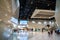 Blurred images of trade fairs in the big hall. image of people walking on a trade fair exhibition or expo where business people