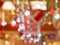 Blurred interior with bokeh: shopping center festively lit and decorated with shiny garlands for holidays, Christmas a
