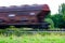 Blurred last wagon of a freight train in motion