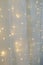 Blurred led light wall garland on white tulle fabric