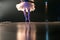 Blurred legs of ballet dancer on stage in theater